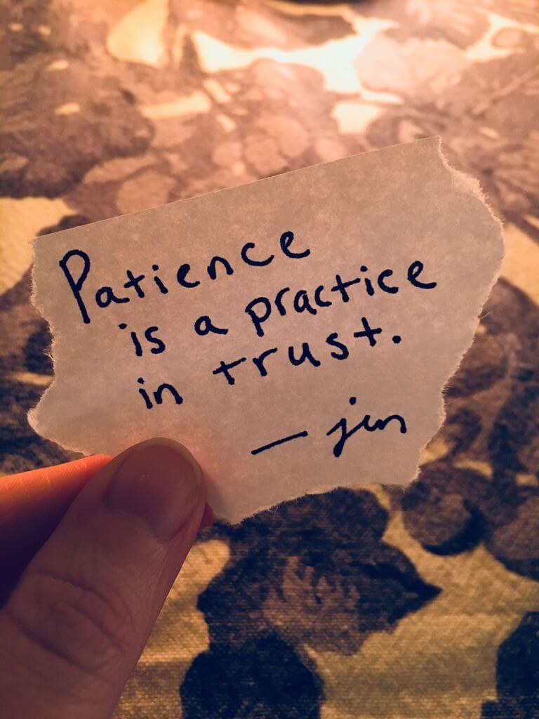 A slip of paper saying "Patience is a practice in trust."