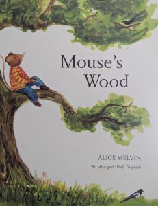 The cover of the book, "Mouse's Wood" is shown with a mouse sitting on a large tree branch gazing up at the sky. The background is white. The tree has leaves in shades of green. The mouse is wearing a yellow sweater with red stripes and blue pants. The author's name, Alice Melvin is in the lower right corner. The title is slightly off centre and to the right.