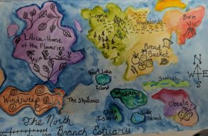 A fantasy world map is illustrated in watercolour and ink. Imaginary place names include Lillica, Higglelands, and Swish. There are ink drawings of flowers, trees, mountains and fruit drawn on brightly coloured islands in blue water. The map includes a compass, scale, and a the title, North Branch Estuary.